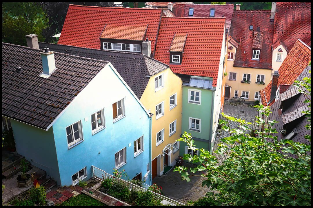a town of houses with a variety of roof colors