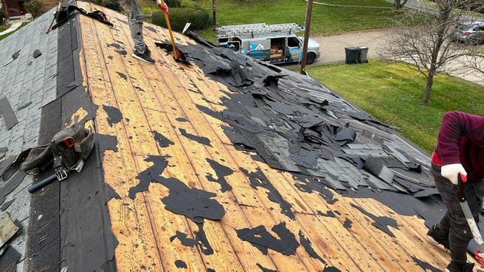 Removing the old shingles from the roof