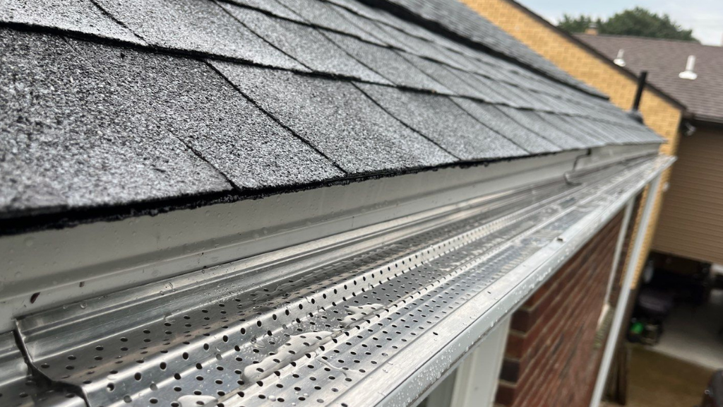 A brand new gutter installed near the roof of a home.