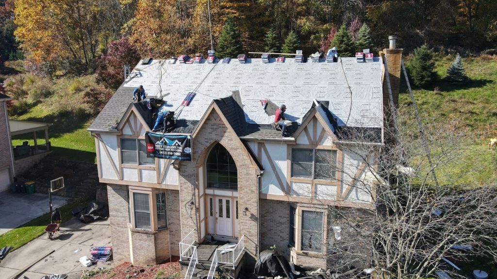 An expensive home getting shingle replacement.