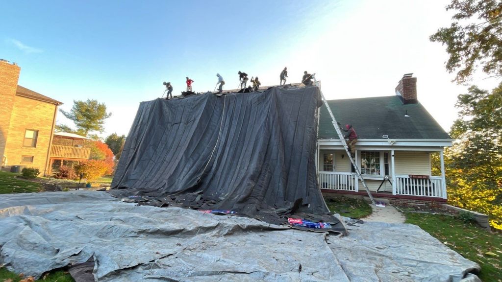 a tarped roof that is being worked on